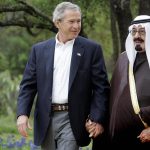 US President George W. Bush (L) holds ha